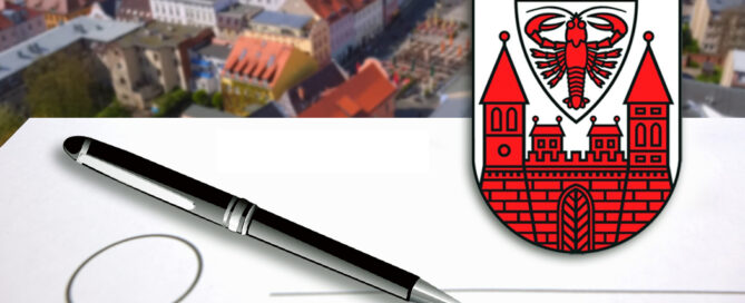 Kugelschreiber auf Wahlunterlage. Rechts daneben das Stadt Cottbus Logo